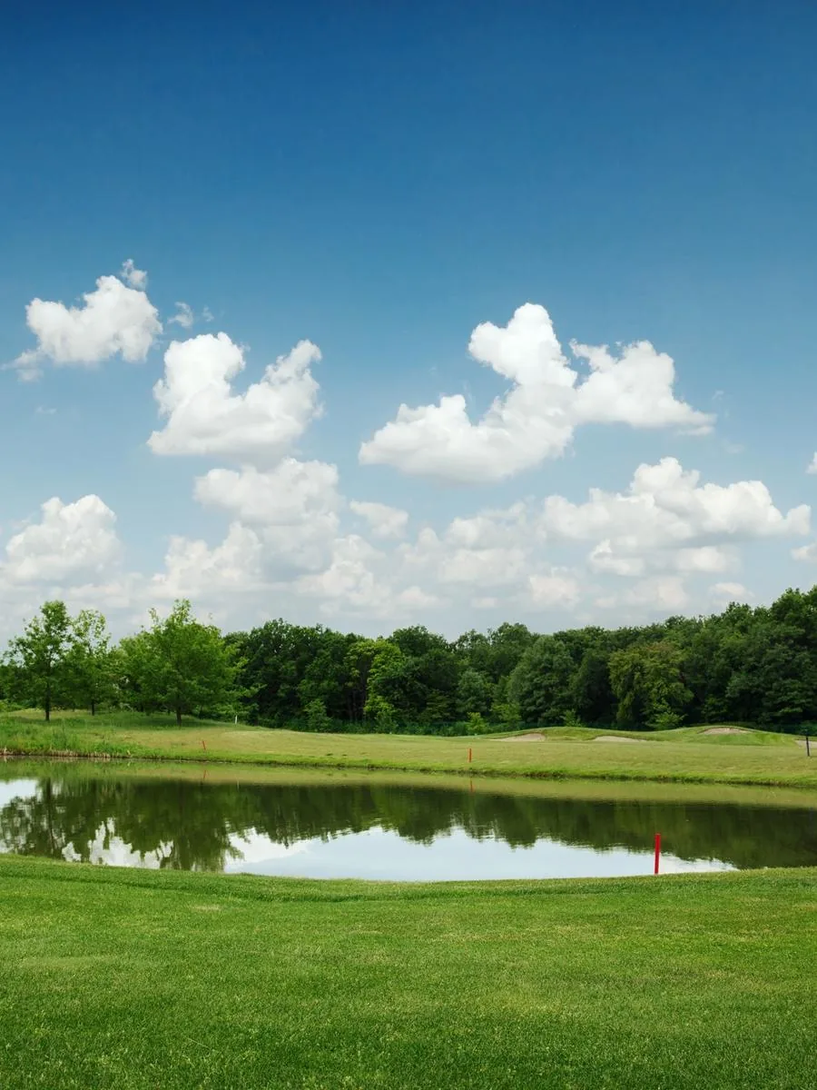 Mirror lake, lawn for golfing on golf course