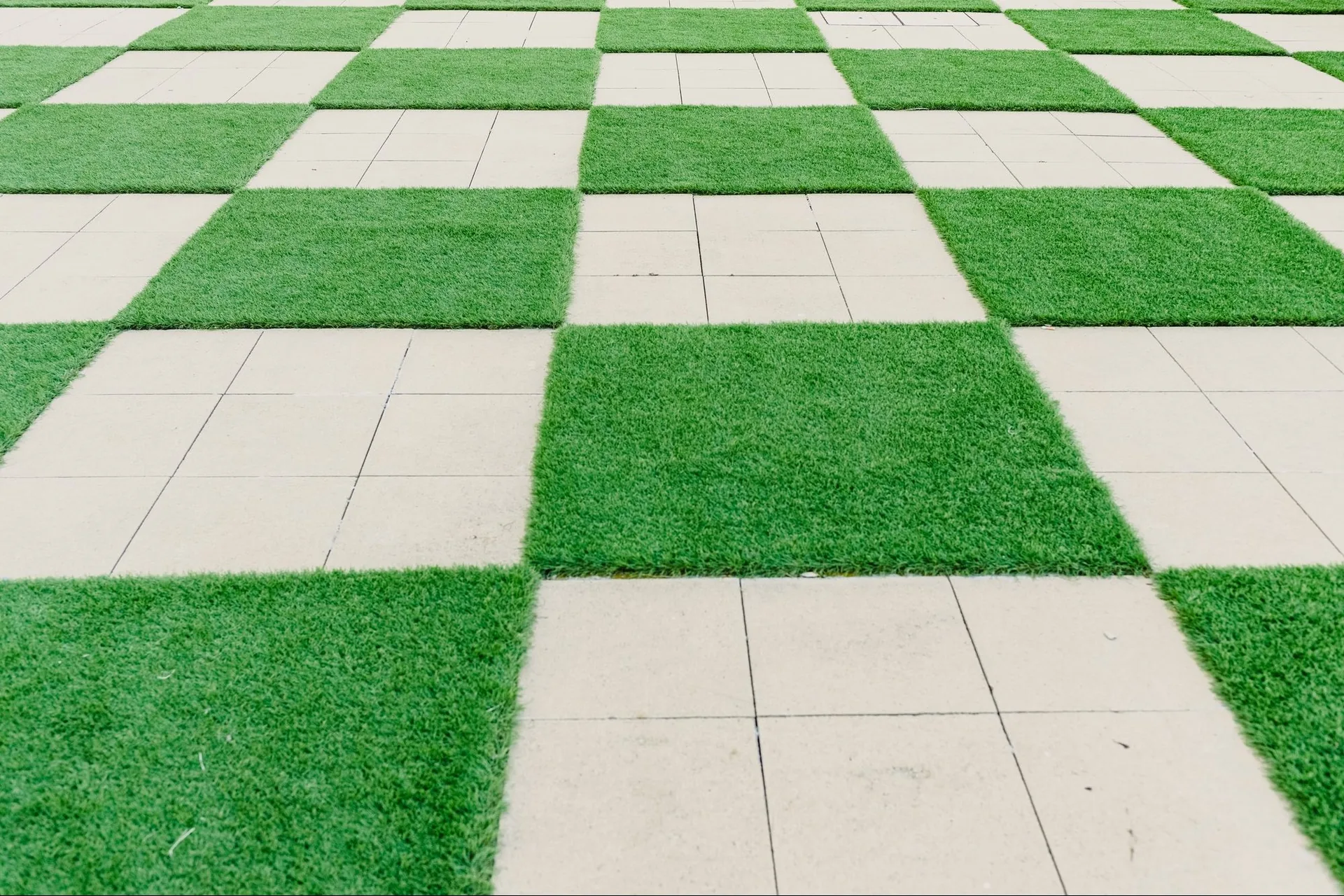 Square pattern of cement and grass